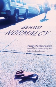 pink rubber glove on sidewalk in foreground (bottom of cover). Female figure from behind walking into the distance along parked cars (her head is no longer visible) in background (top of cover)